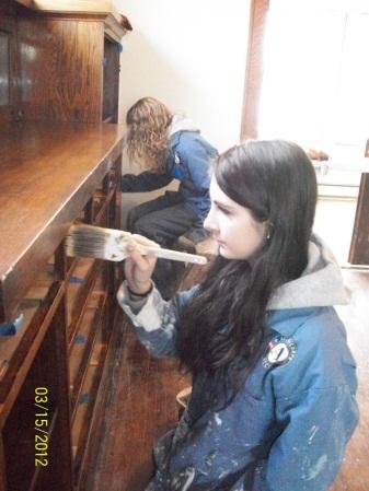 Article Thumbnail. Anna and Michelle staining wood.