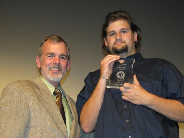 Article Thumbnail. Ryan Flynn of Oak 4 received “Outstanding Personal Achievement Award”., Region Director Dan Milnes